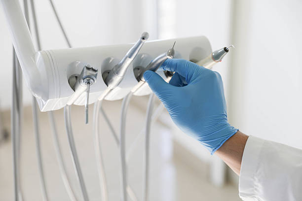 Professional Tooth Extraction technician working in Huntsville, MO